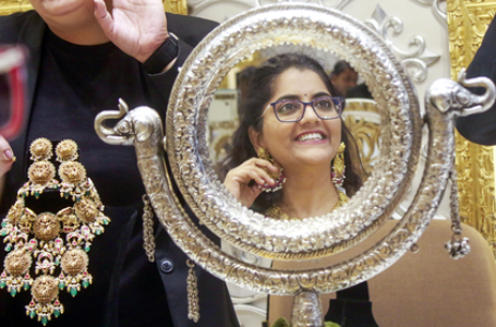 Gold prices slip after US Fed signals more gradual path for rate cuts